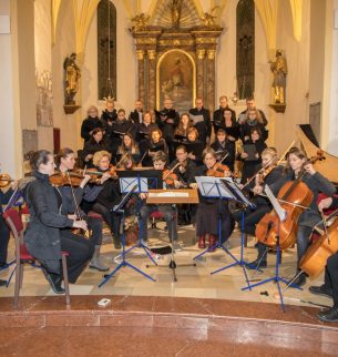 A young orchestra in a church building