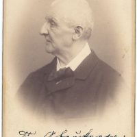 Historical photograph of an older Anton Bruckner looking to the left in profile